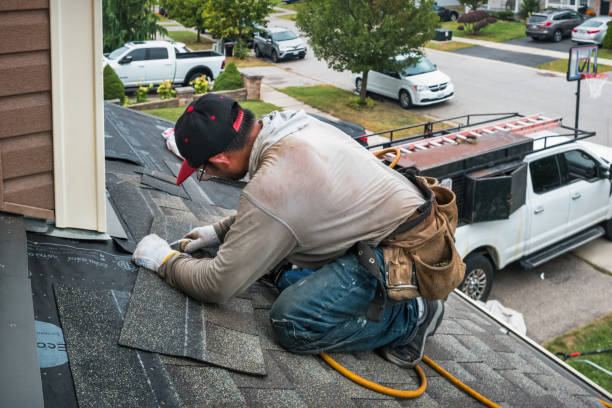 Professional Roofing technician working in Columbus, KS